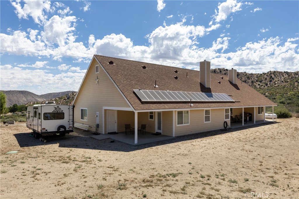 5935 Monte Vista Road Phelan, CA 92371 - Photo 46 of 58 a view of a house with a snow in the yard
