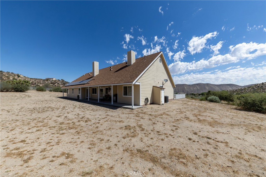 5935 Monte Vista Road Phelan, CA 92371 - Photo 47 of 58 a view of a house with a yard
