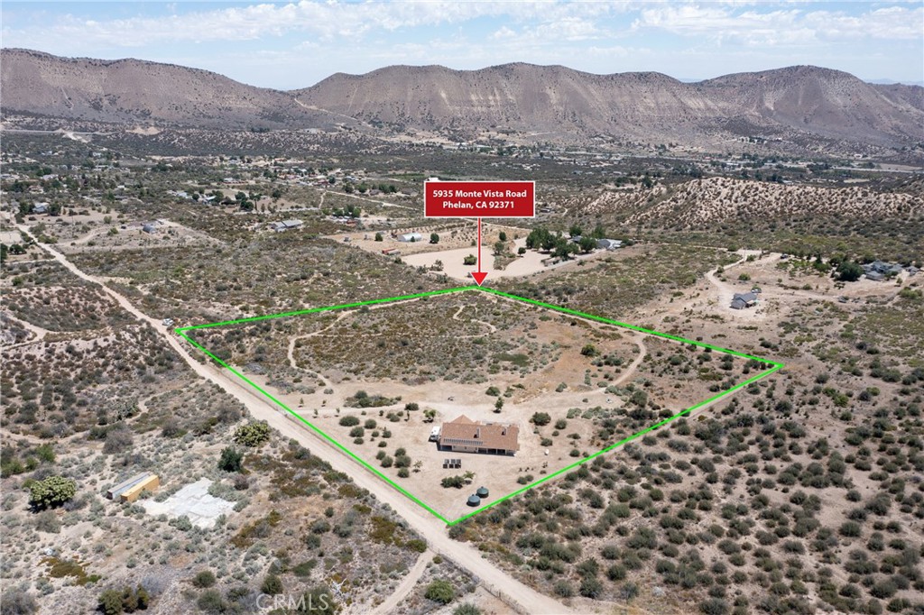 5935 Monte Vista Road Phelan, CA 92371 - Photo 50 of 58 a view of a field with a mountain in the background