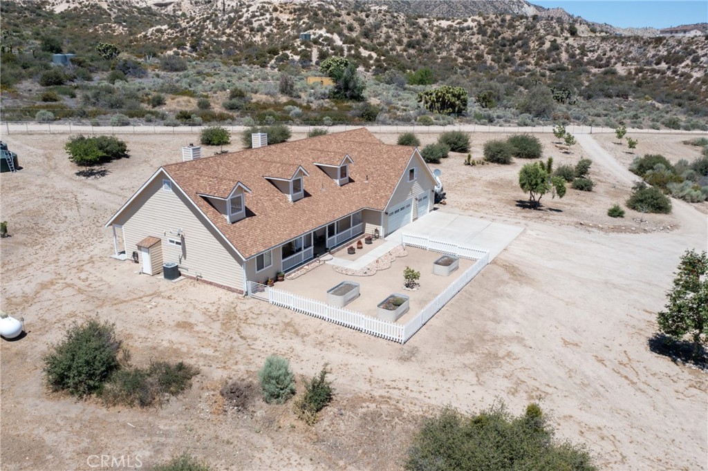 5935 Monte Vista Road Phelan, CA 92371 - Photo 55 of 58 an aerial view of a house with yard and mountain view in back