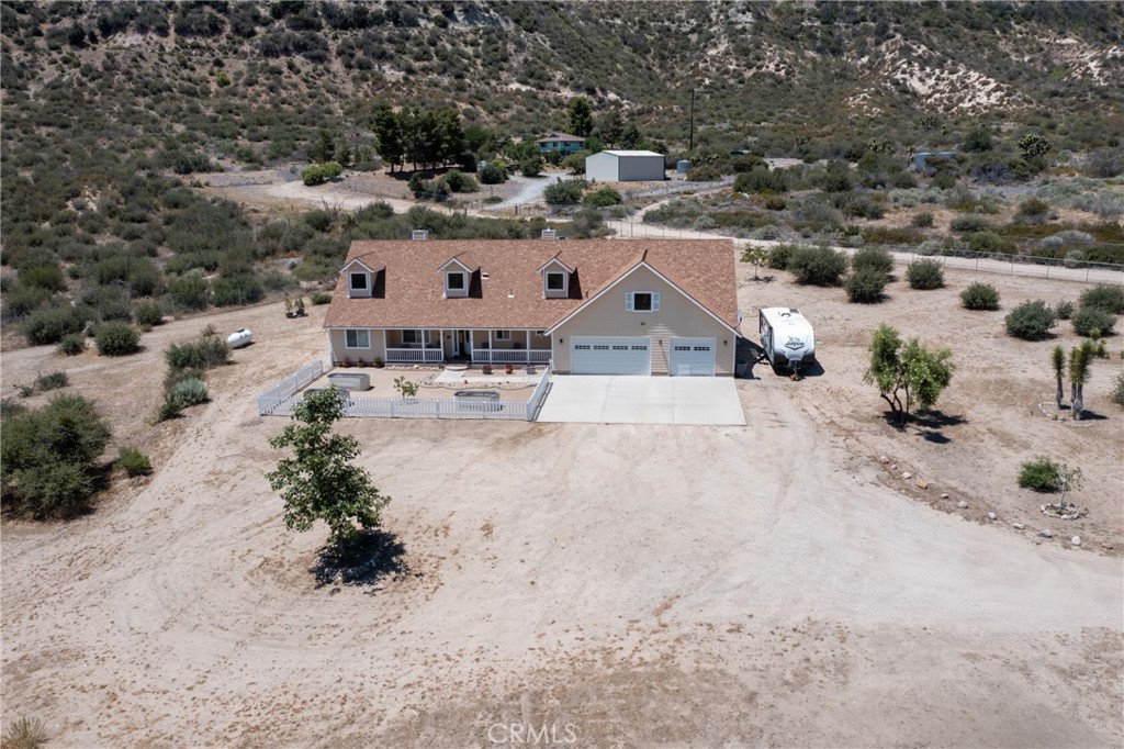 5935 Monte Vista Road Phelan, CA 92371 - Photo 7 of 58 an aerial view of a house with a yard and trees