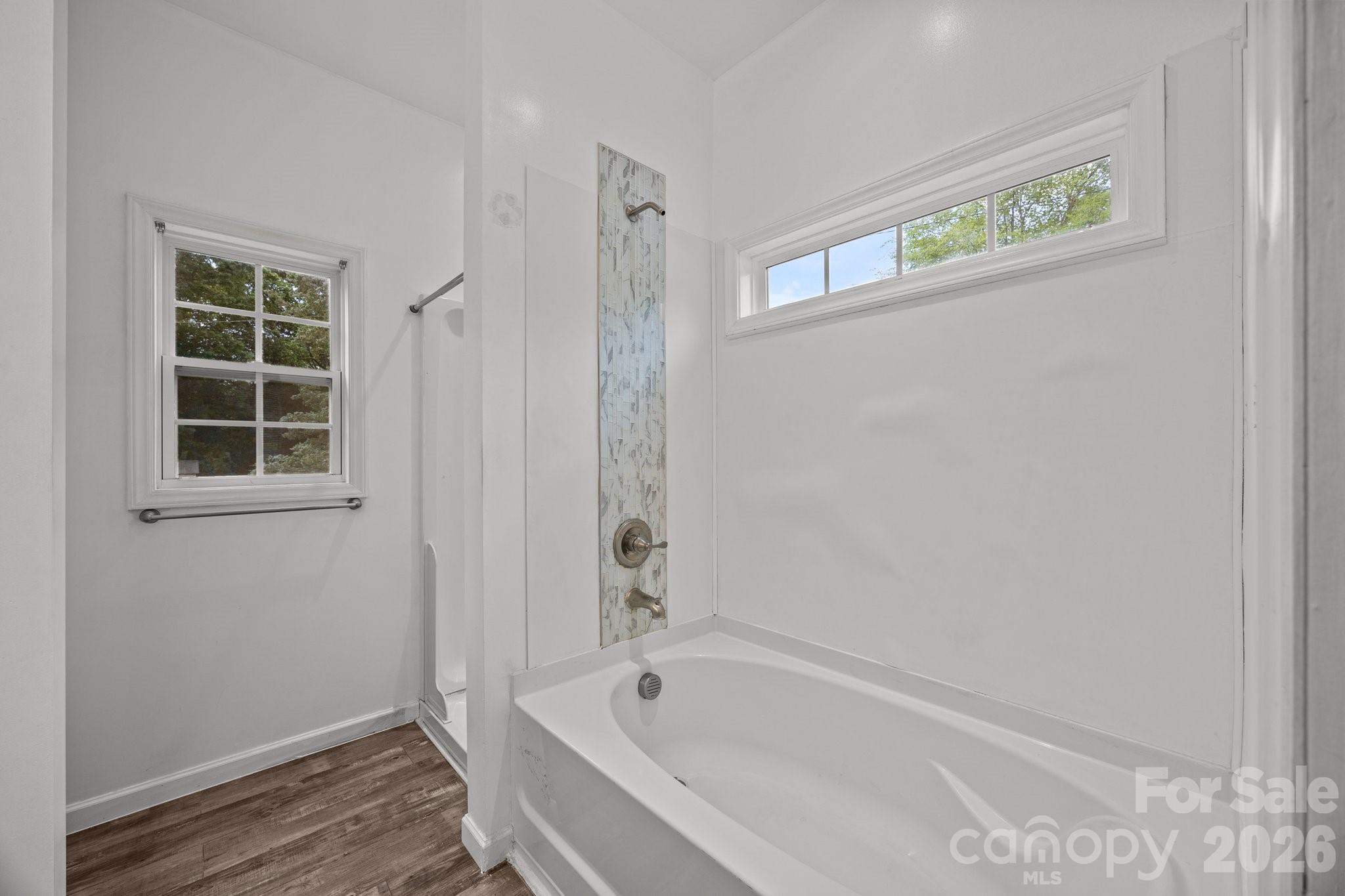 14532 East Rocky River Road Davidson, NC 28036 - Photo 27 of 32 a white bath tub sitting next to a window