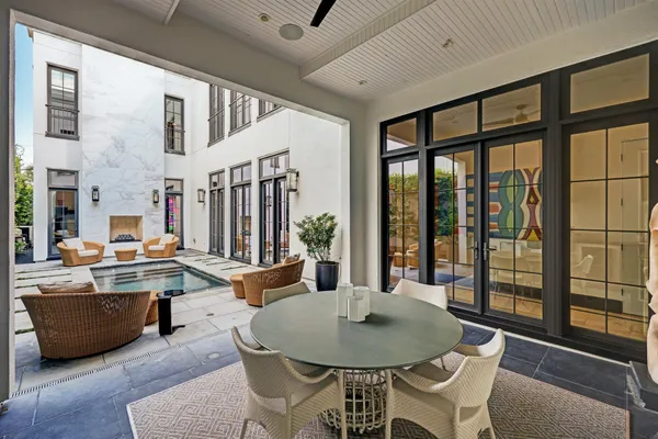 a dinning table and chairs in a patio