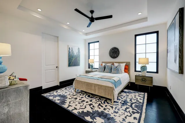 a bedroom with bed and window