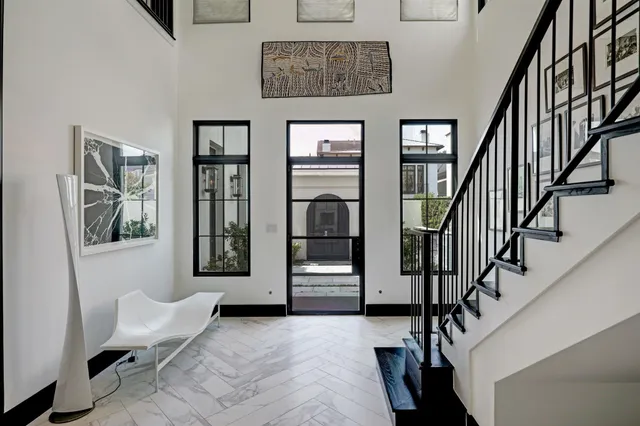 a view of entryway and hall with wooden floor