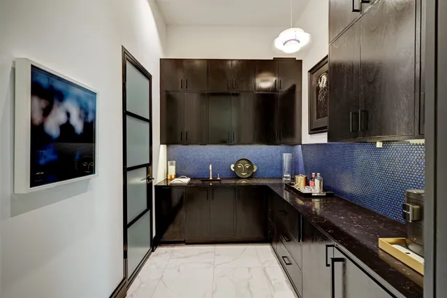 a kitchen with a sink and cabinets