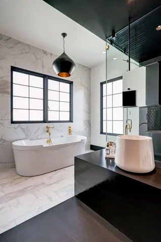 a living room with large window and a table