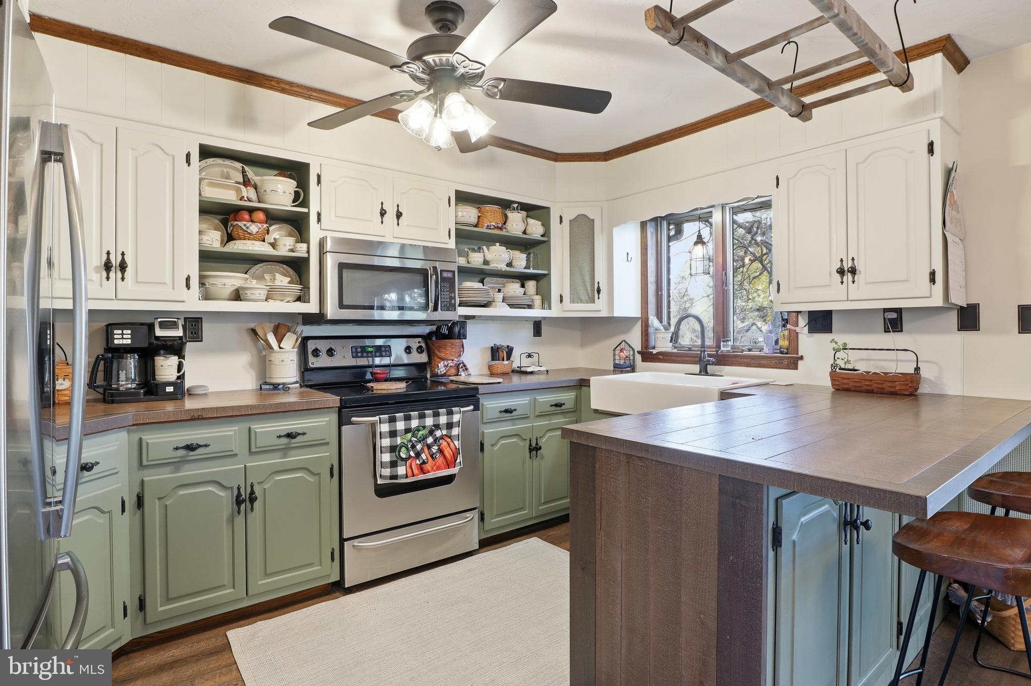 1934 Forge Heights Ln Spring Grove Spring Grove, PA 17362 - Photo 18 of 53 a kitchen with stainless steel appliances a stove a sink and a refrigerator