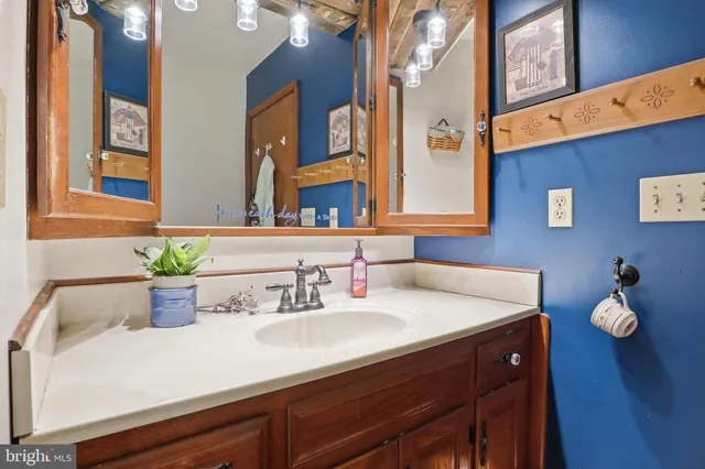 a living room with furniture and a lamp