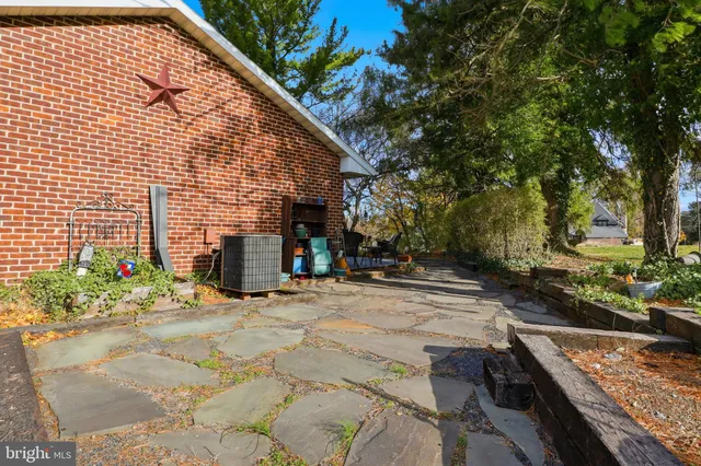 a backyard of a house with outdoor seating