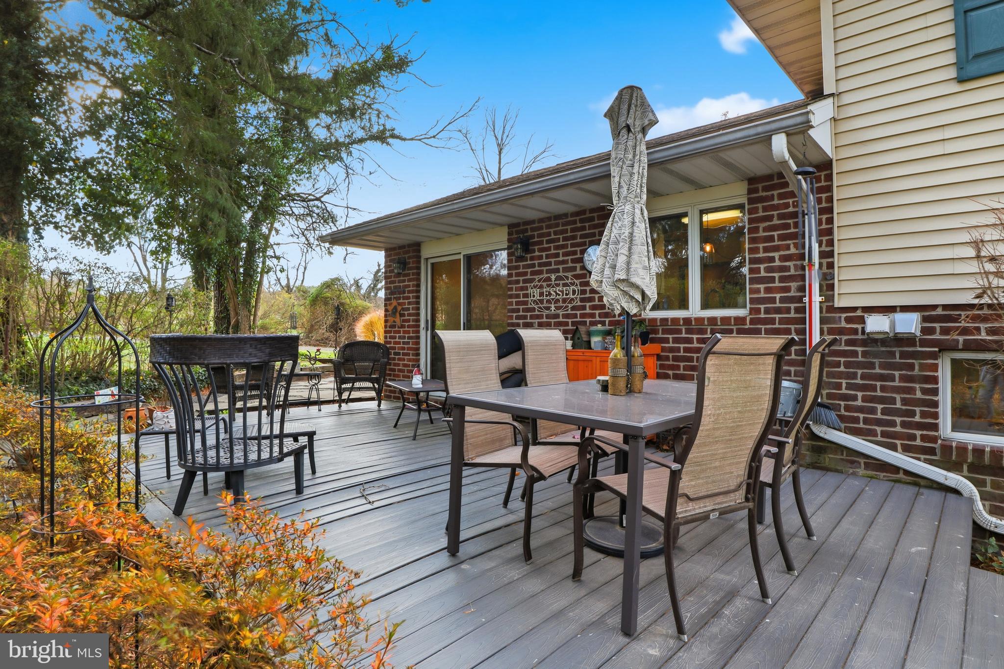 1934 Forge Heights Ln Spring Grove Spring Grove, PA 17362 - Photo 7 of 53 a view of a patio with table and chairs with wooden floor and fence