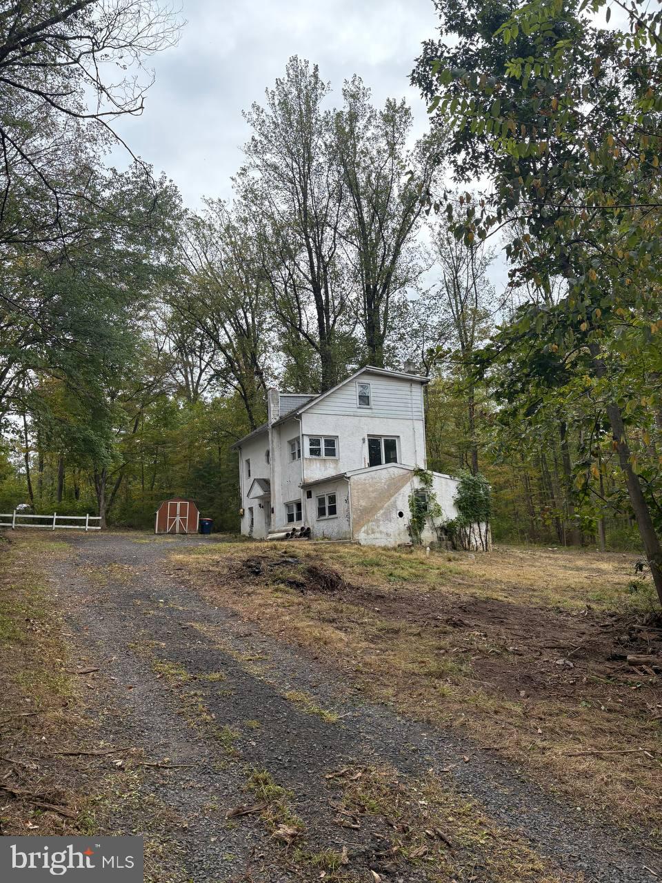 2034 Woodland Road Jamison, PA 18929 - Photo 3 of 22 a view of a house with a large tree in front of it