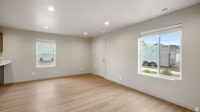 1223 East 1775 North Payson, UT 84651 - Photo 23 of 45 Spacious room featuring wood-finish flooring, recessed lighting, and ample natural light from multiple windows