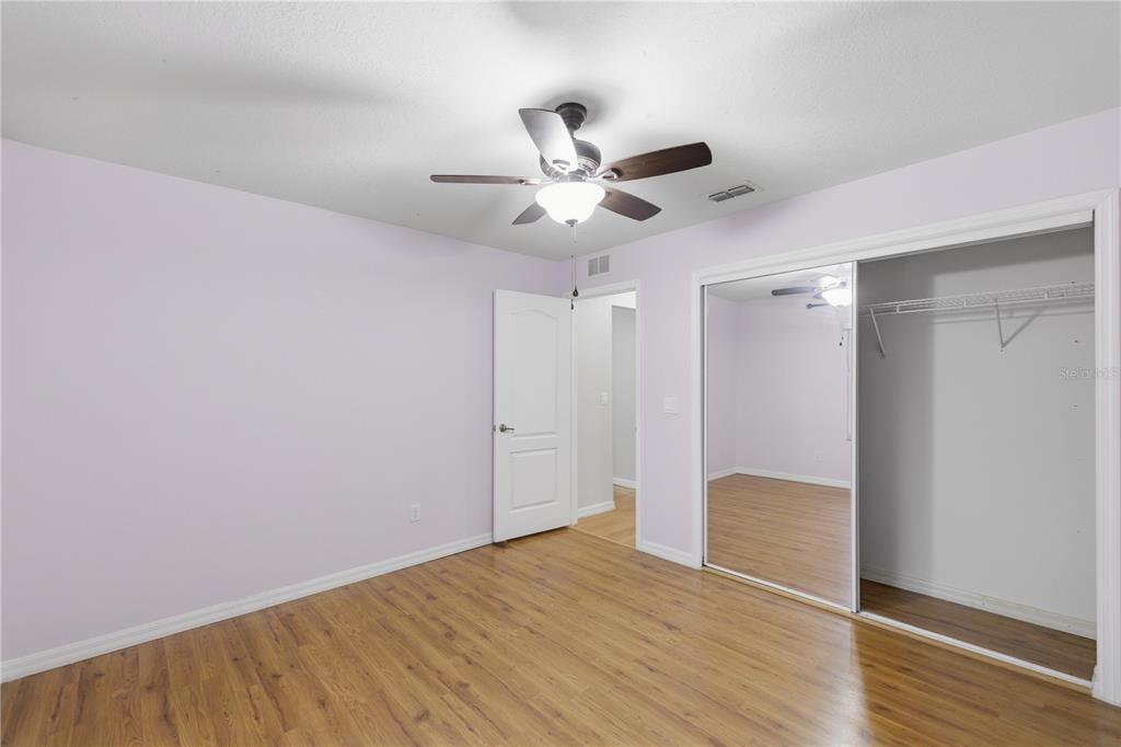 5365 Southwest 84th Place Ocala, FL 34476 - Photo 22 of 28 a view of an empty room and wooden floor