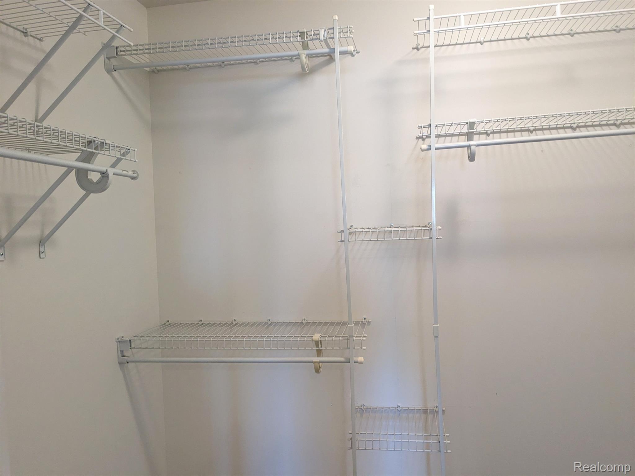 23366 Sunset Road, Unit 21 Taylor, MI 48180 - Photo 18 of 20 Primary Bedroom Walk In Closet