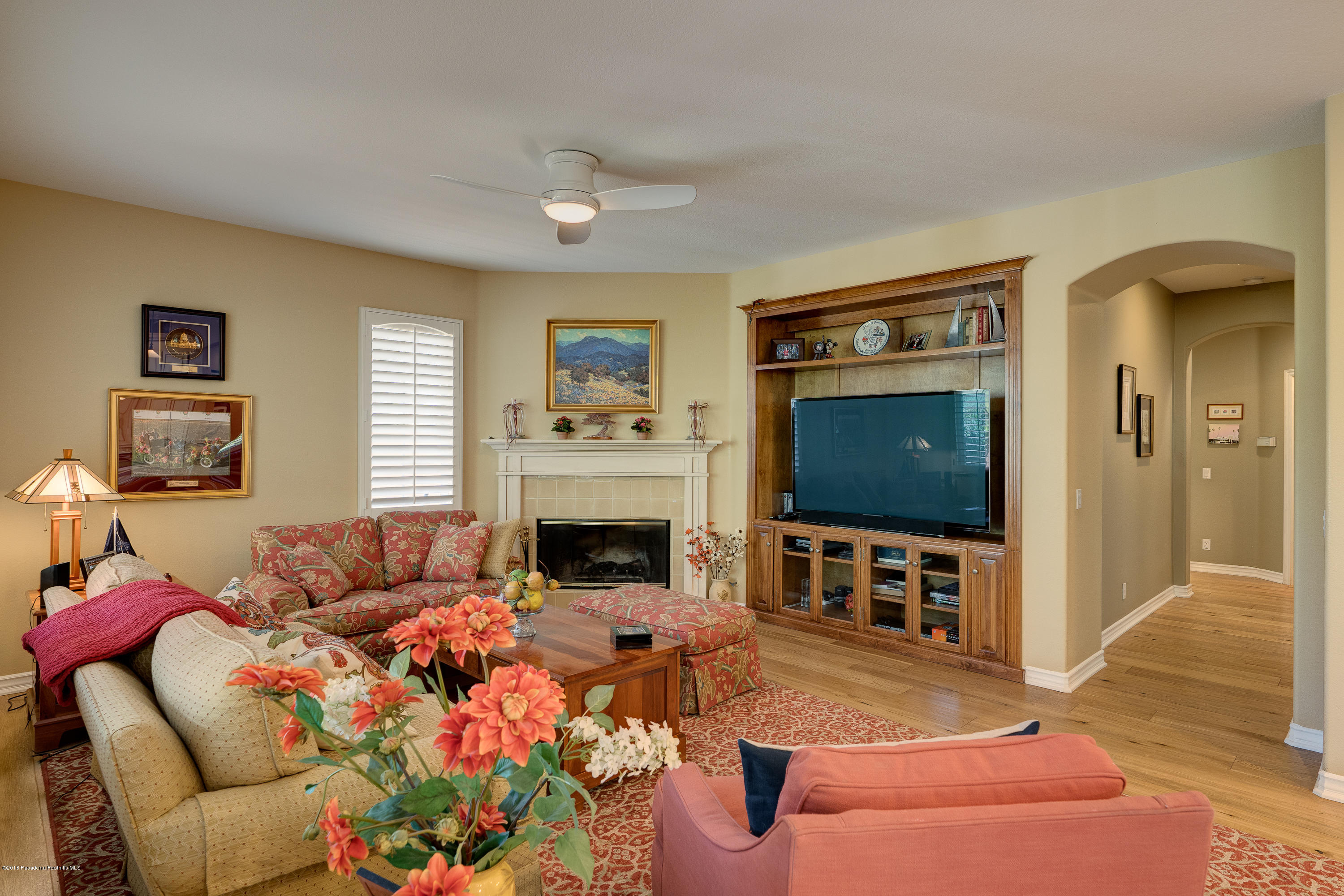 3520 Giddings Ranch Road Altadena, CA 91001 - Photo 14 of 41 a living room with furniture a flat screen tv and a fireplace