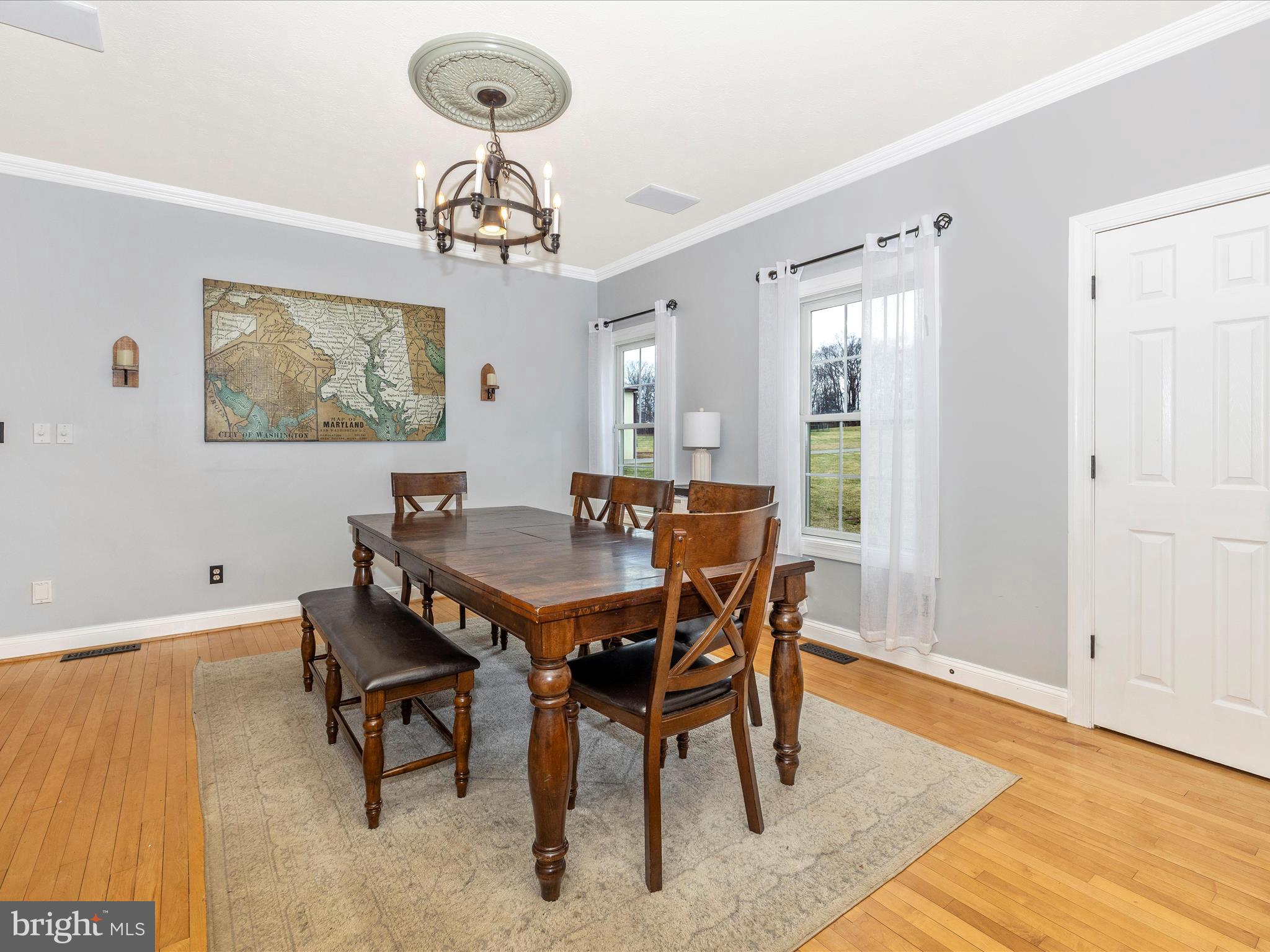 1345 Brehm Road Westminster, MD 21157 - Photo 19 of 131 a view of a dining room with furniture wooden floor and a chandelier