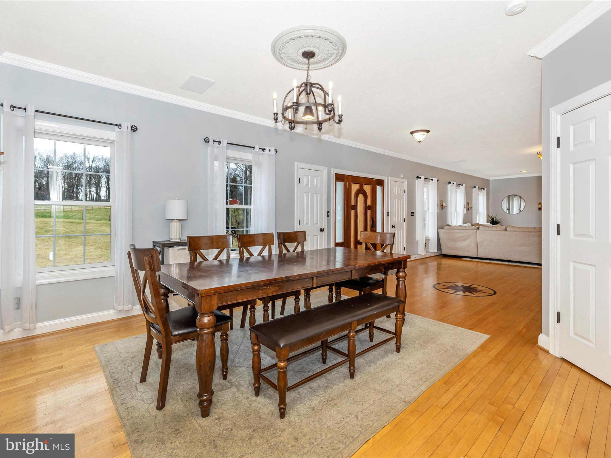1345 Brehm Road Westminster, MD 21157 - Photo 21 of 131 a view of a dining room with furniture a chandelier and wooden floor