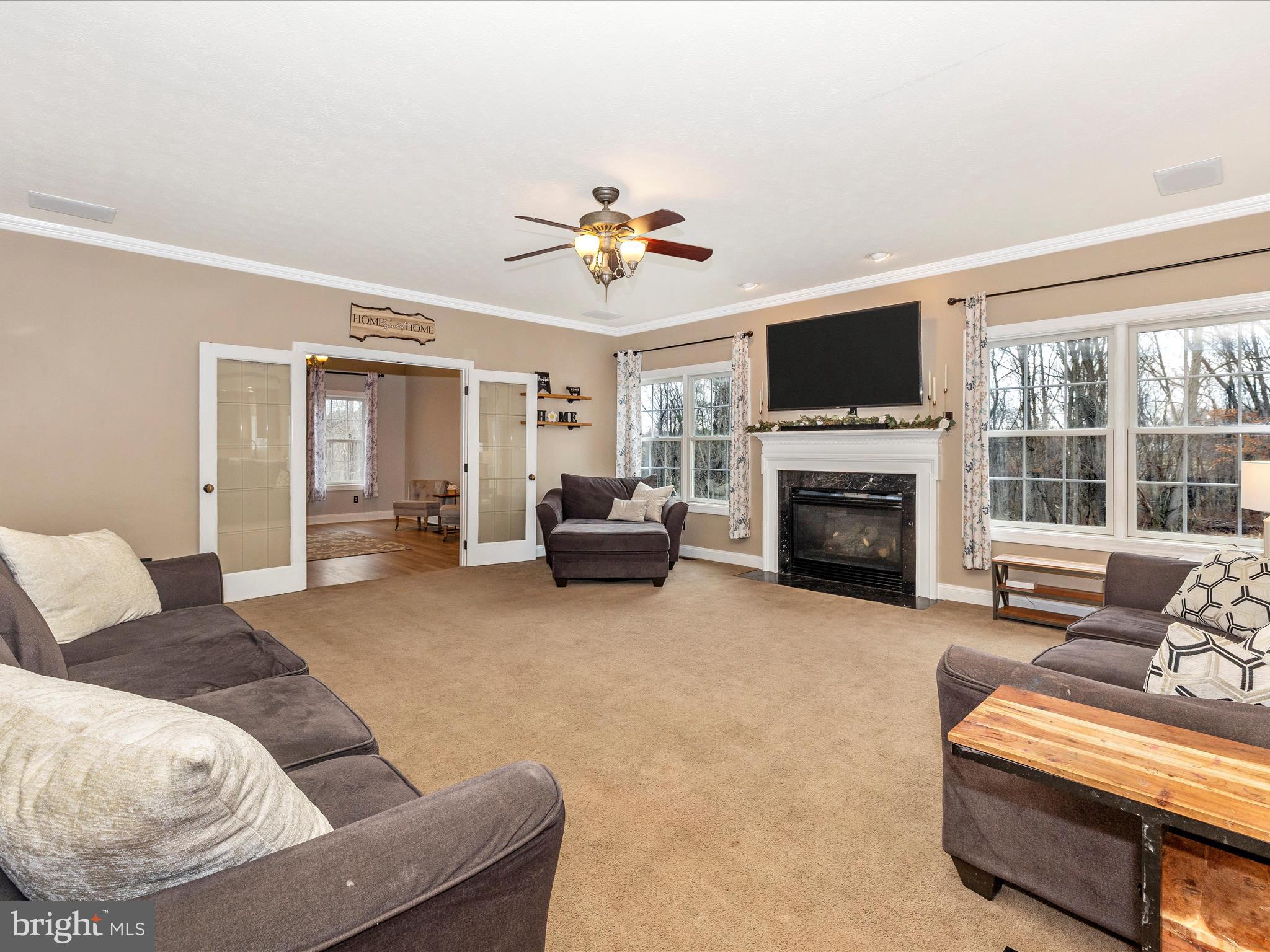 1345 Brehm Road Westminster, MD 21157 - Photo 30 of 131 a living room with furniture a flat screen tv and a fireplace
