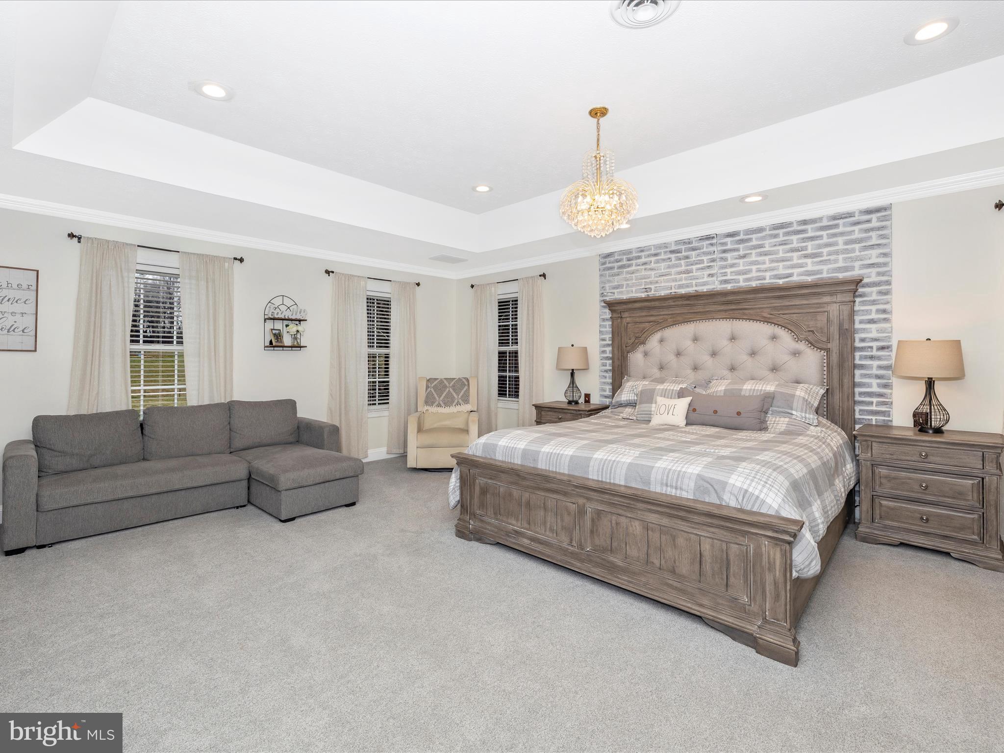 1345 Brehm Road Westminster, MD 21157 - Photo 37 of 131 a spacious bedroom with a bed and a couch