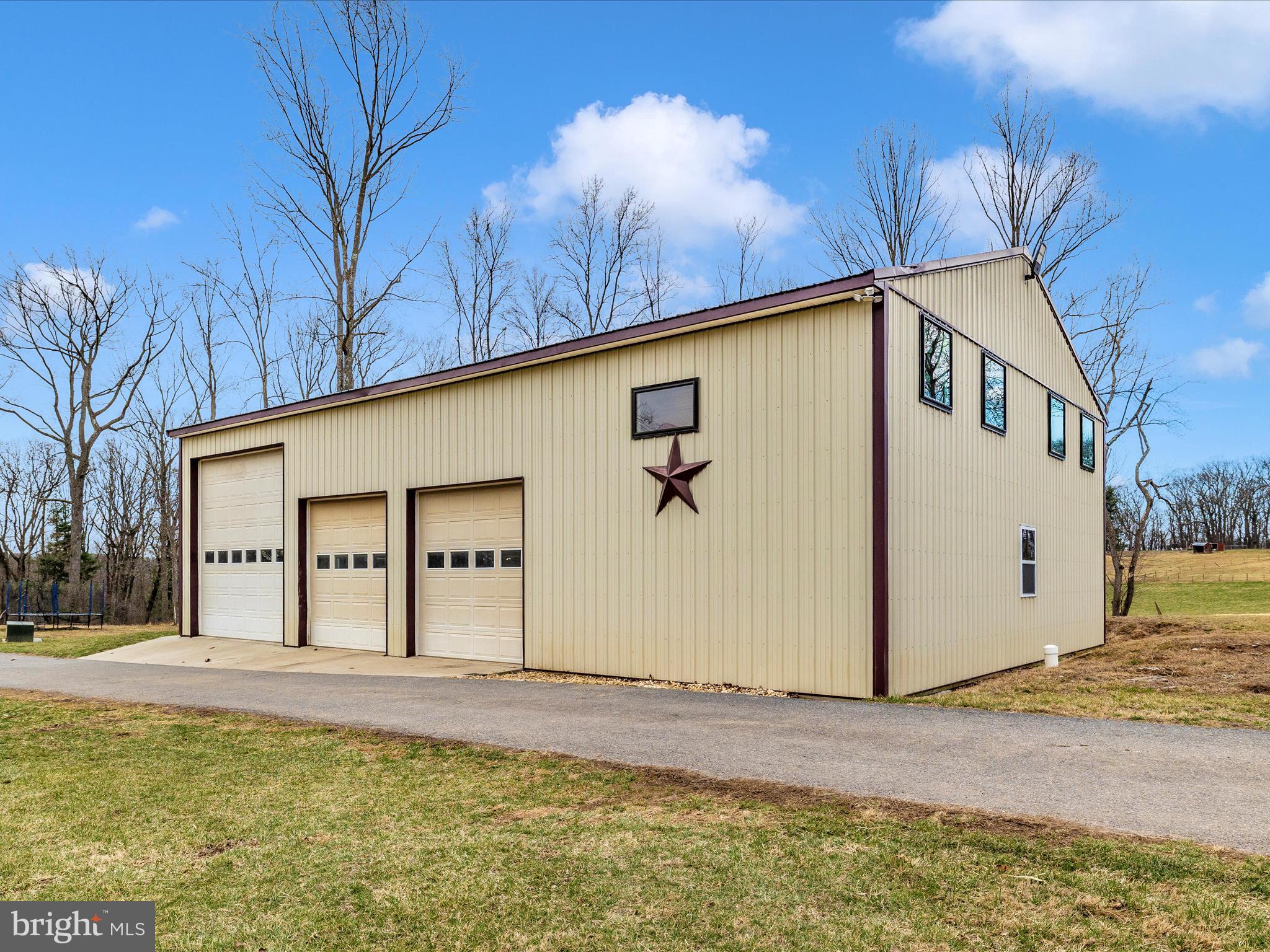 1345 Brehm Road Westminster, MD 21157 - Photo 4 of 131 a front view of a house with a yard and garage