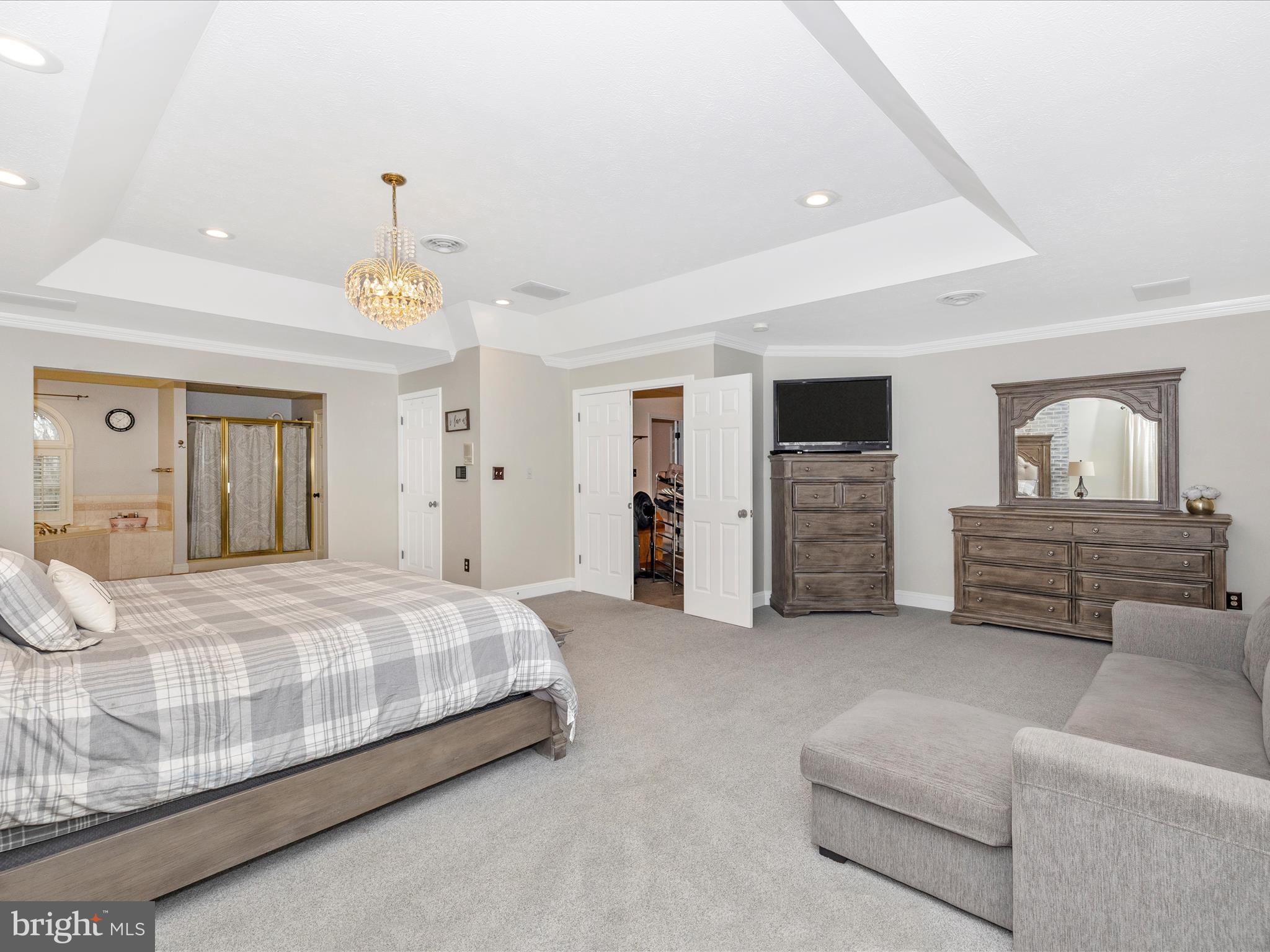 1345 Brehm Road Westminster, MD 21157 - Photo 41 of 131 a spacious bedroom with a bed a couch and chandelier