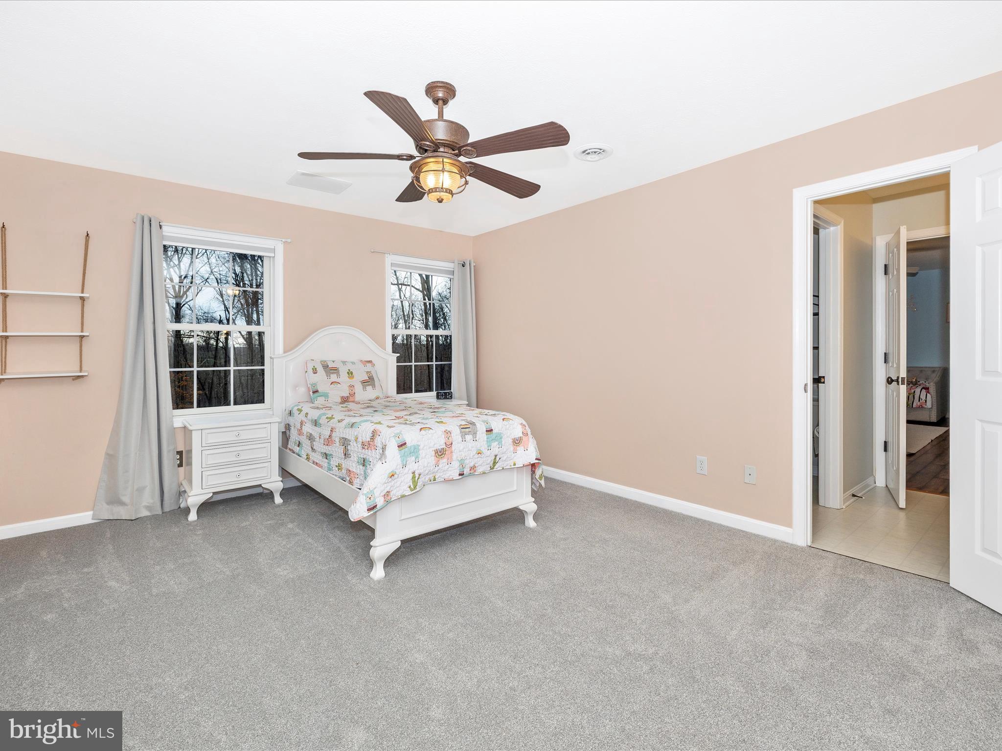1345 Brehm Road Westminster, MD 21157 - Photo 51 of 131 a bedroom with a bed and a chandelier