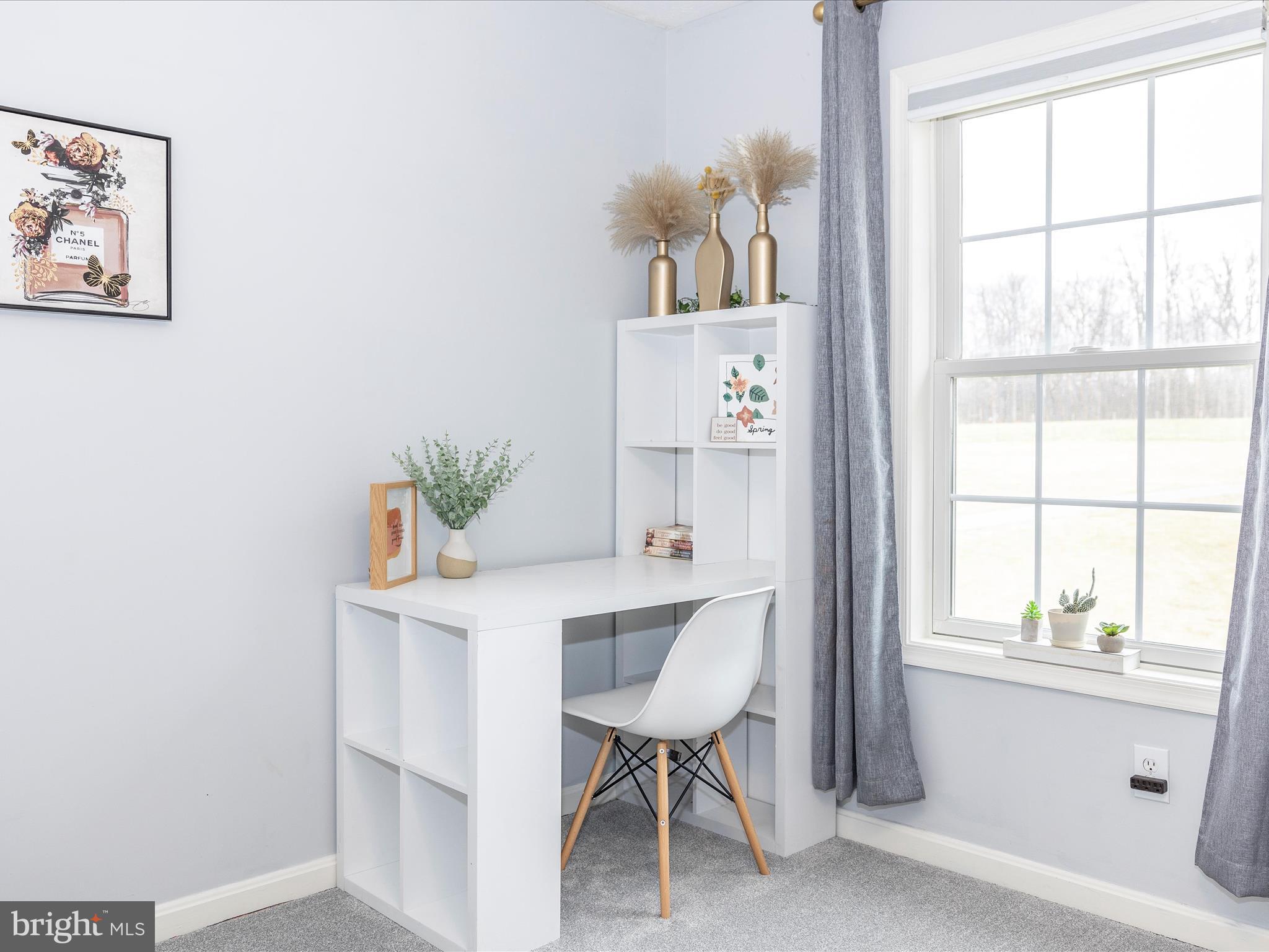 1345 Brehm Road Westminster, MD 21157 - Photo 62 of 131 a view of a workspace with furniture and a window