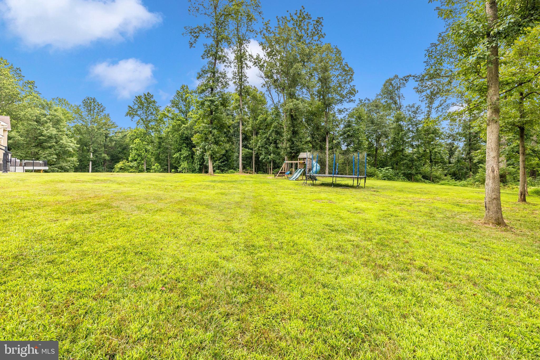 1345 Brehm Road Westminster, MD 21157 - Photo 92 of 131 a view of a large yard with an outdoor space and seating area