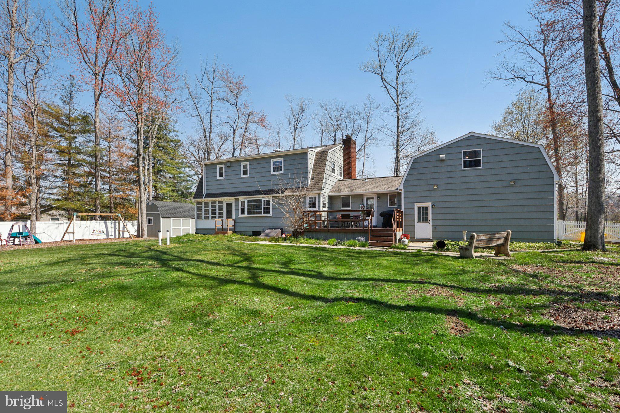 351 Merrick Road Robbinsville, NJ 08691 - Photo 52 of 69 a front view of a house with a yard table and chairs