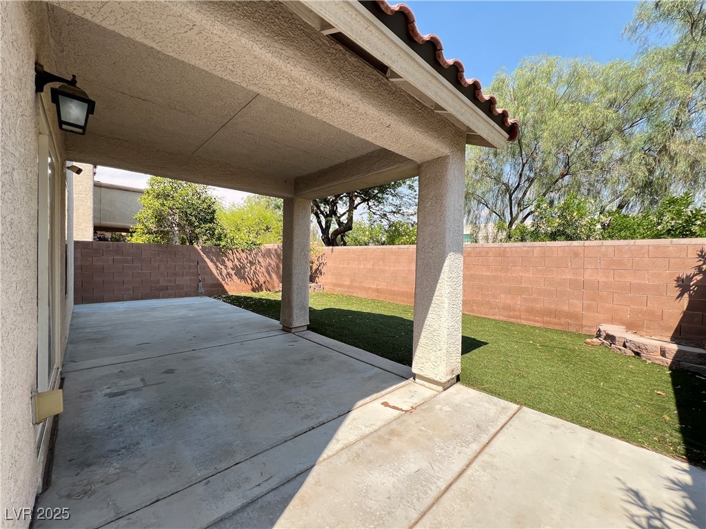 8708 Palomino Ranch Street Las Vegas, NV 89131 - Photo 16 of 19 Fenced backyard featuring a patio area
