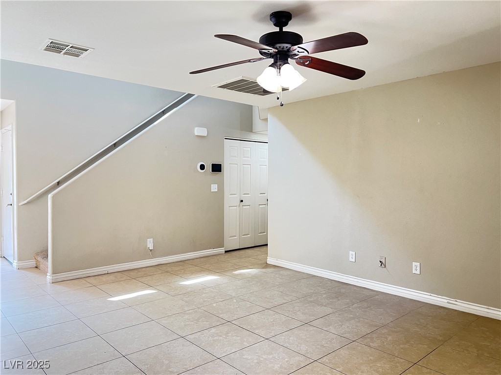 8708 Palomino Ranch Street Las Vegas, NV 89131 - Photo 4 of 19 Unfurnished room featuring ceiling fan and light tile patterned floors