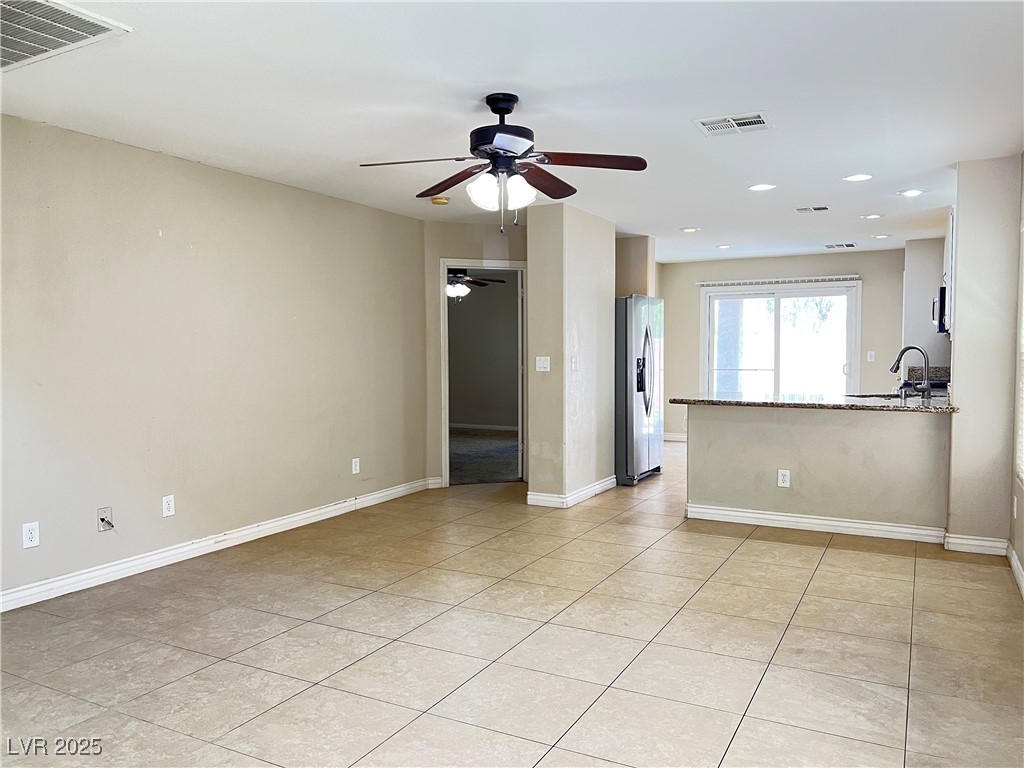 8708 Palomino Ranch Street Las Vegas, NV 89131 - Photo 5 of 19 Spare room featuring light tile patterned flooring, ceiling fan, and recessed lighting