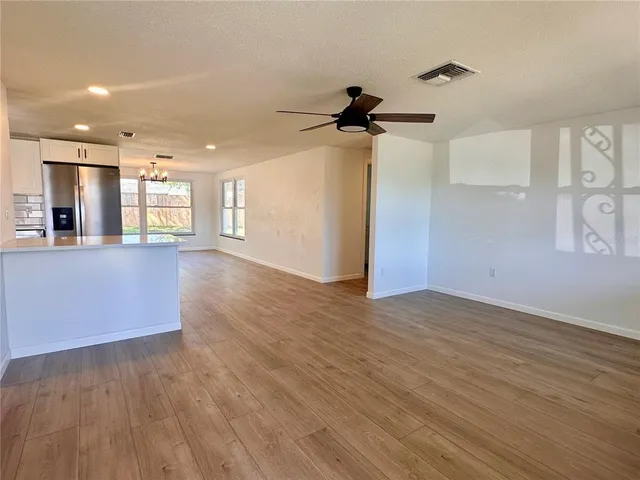 a view of a kitchen with a sink and a window
