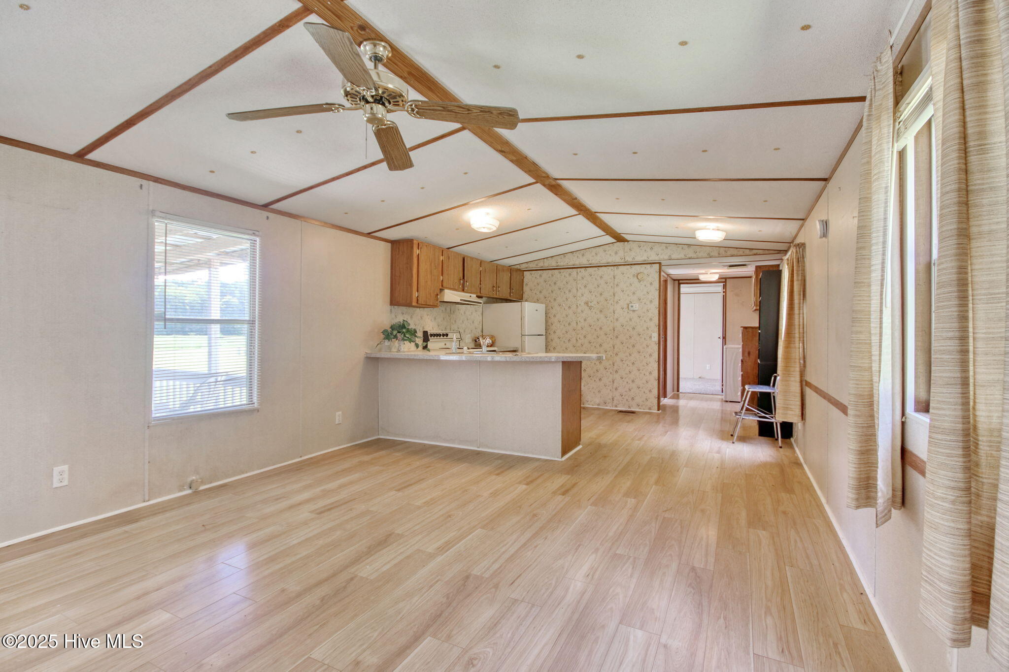 6952 Reed Trail Northwest Ocean Isle Beach, NC 28469 - Photo 3 of 25 Open Living Room for easy entertaining!