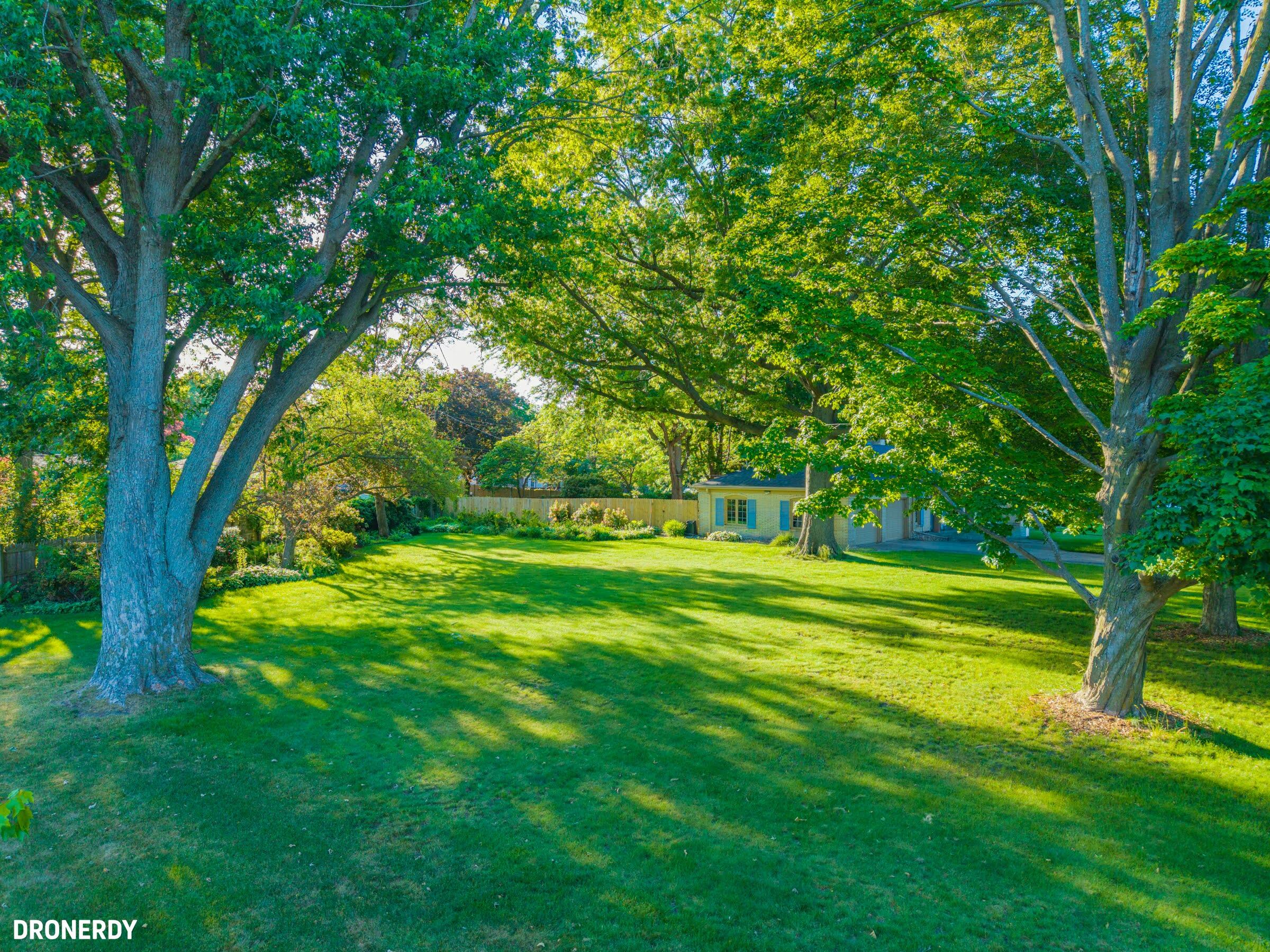 0 Maple Street Michigan City, IN 46360 - Photo 6 of 8 a view of a grassy field with trees in the background