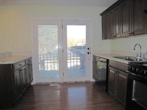 354 Gehrig Circle Bolingbrook, IL 60440 - Photo 2 of 11 a kitchen with stainless steel appliances granite countertop a stove a sink and a refrigerator with wooden cabinets