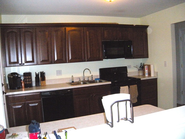 354 Gehrig Circle Bolingbrook, IL 60440 - Photo 3 of 11 a kitchen with granite countertop a sink cabinets and black appliances
