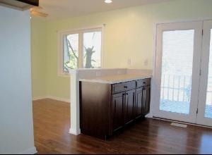 354 Gehrig Circle Bolingbrook, IL 60440 - Photo 4 of 11 an empty room with wooden floor cabinet and windows