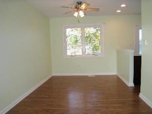 354 Gehrig Circle Bolingbrook, IL 60440 - Photo 5 of 11 an empty room with wooden floor chandelier fan and windows