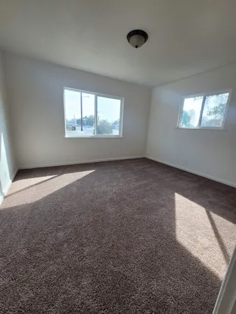 an empty room with windows