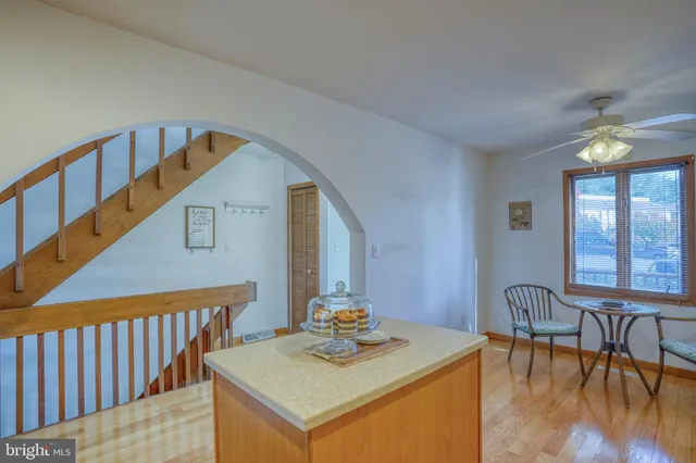a view of small space with wooden floor and windows