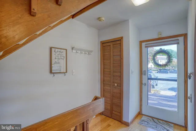 a bathroom with a sink vanity mirror and toilet