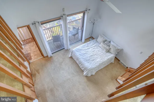 a bedroom with a bed and a table