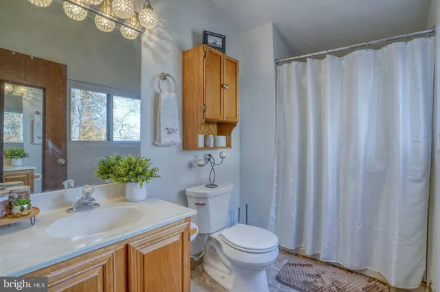 a bedroom with a bed and lamp