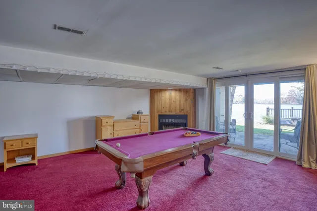 an aerial view of residential houses with outdoor space and swimming pool