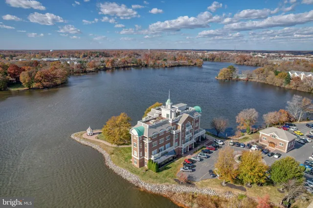 a view of a building with a backyard front of house