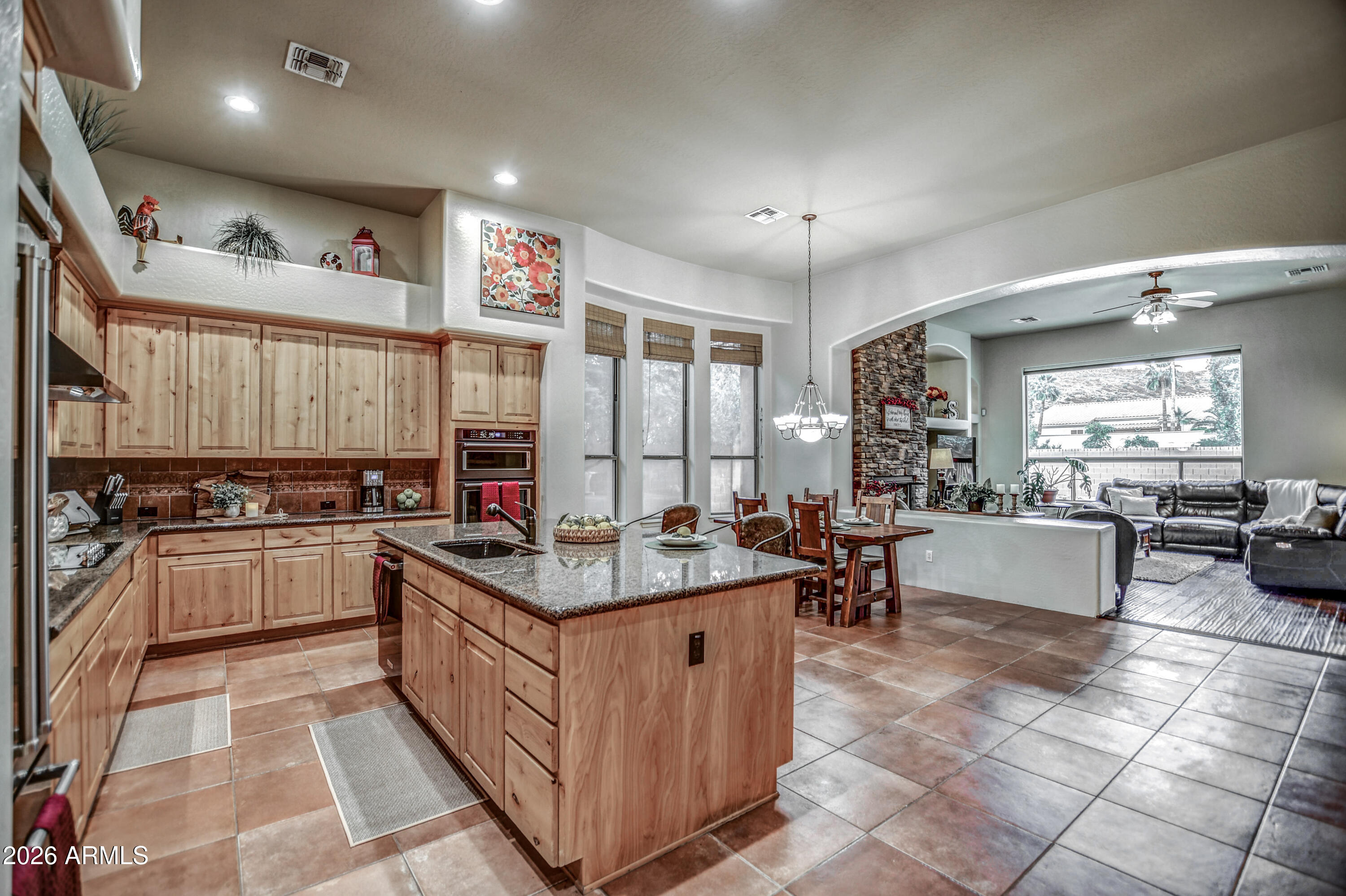25801 North Lawler Loop Phoenix, AZ 85083 - Photo 15 of 43 a kitchen with stainless steel appliances granite countertop lots of counter top space