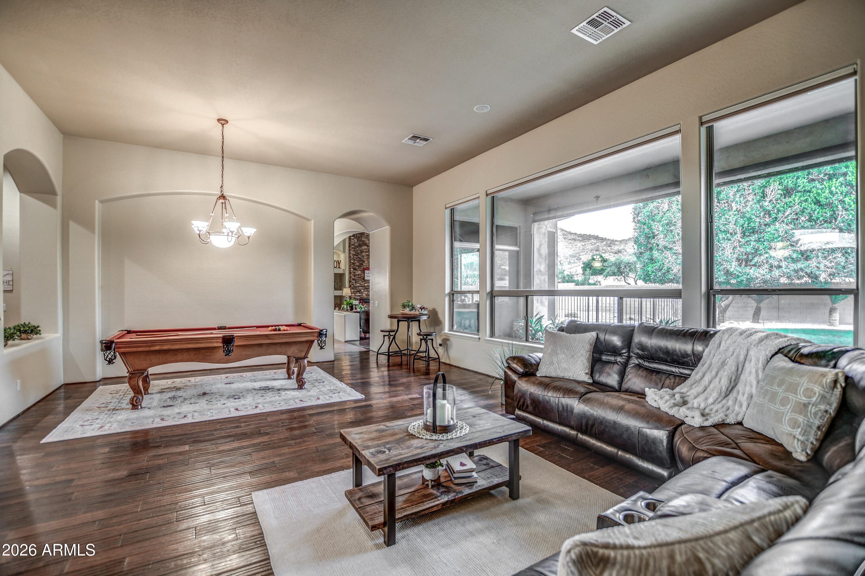 25801 North Lawler Loop Phoenix, AZ 85083 - Photo 6 of 43 a living room with furniture and wooden floor
