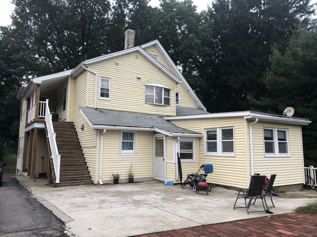 50 Mt Ararat Road, Unit 3 Quincy, MA 02169 - Photo 1 of 11 a view of a house with a patio